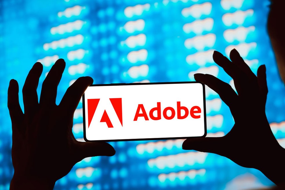 Adobe lucra acima da expectativa no 1º tri fiscal mas reduz projeções