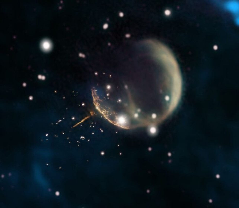 Um pulsar chamado J0002, afastando-se de uma supernova a 1.130 quilômetros por segundo — Foto: J. English/University of Manitoba/NRAO/F. Schinzel et al./DRAO/Canadian Galactic Plane Survey/NASA/IRAS)